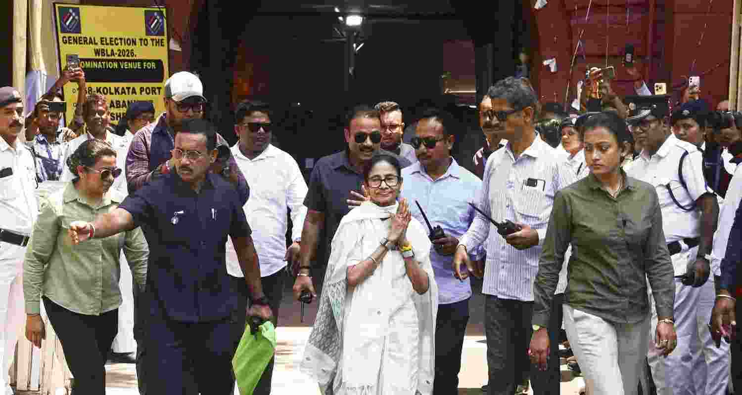 West Bengal Chief Minister and TMC candidate from Bhabanipur constituency, Mamata Banerjee, waves to supporters after filing her nomination in the state Assembly elections, in Kolkata, Wednesday, April 8, 2026. 