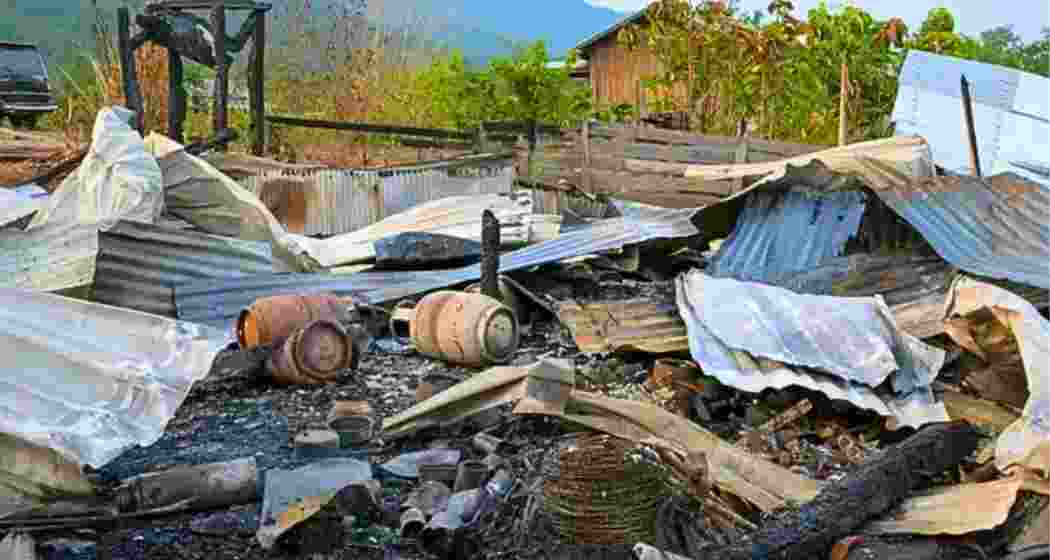 Charred houses stand in Kamjong district after fresh violence near the Indo-Myanmar border forced villagers and Myanmar refugees to flee their homes. (Representative image)