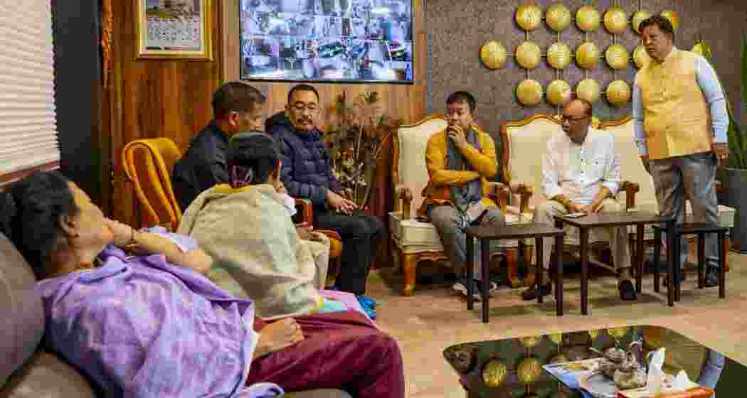 Manipur Chief Minister Yumnam Khemchand Singh visits an injured woman at Raj Medicity following the Tronglaobi attack, in Imphal. (@YKhemchandSingh/X via PTI Photo).