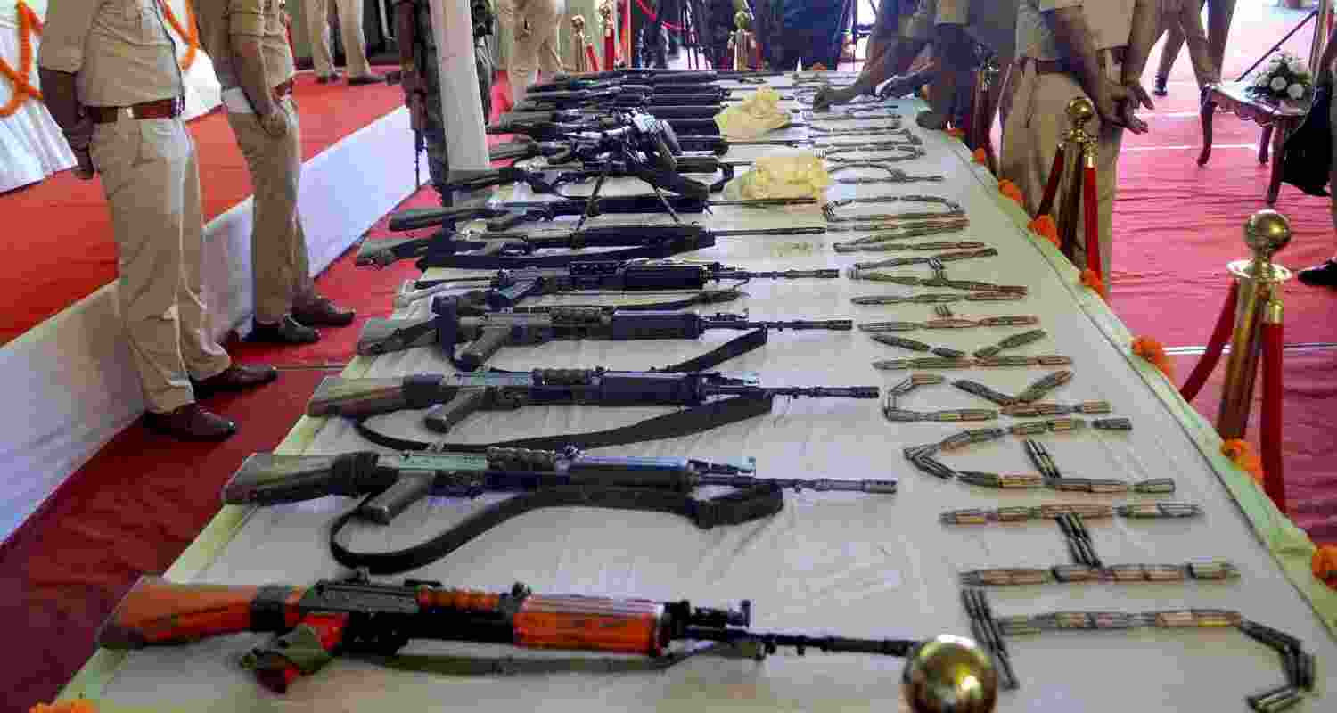 Arms and ammunition surrendered by 27 Maoists are displayed during an event after their surrender, in Ranchi, Jharkhand, Thursday, May 21, 2026. 