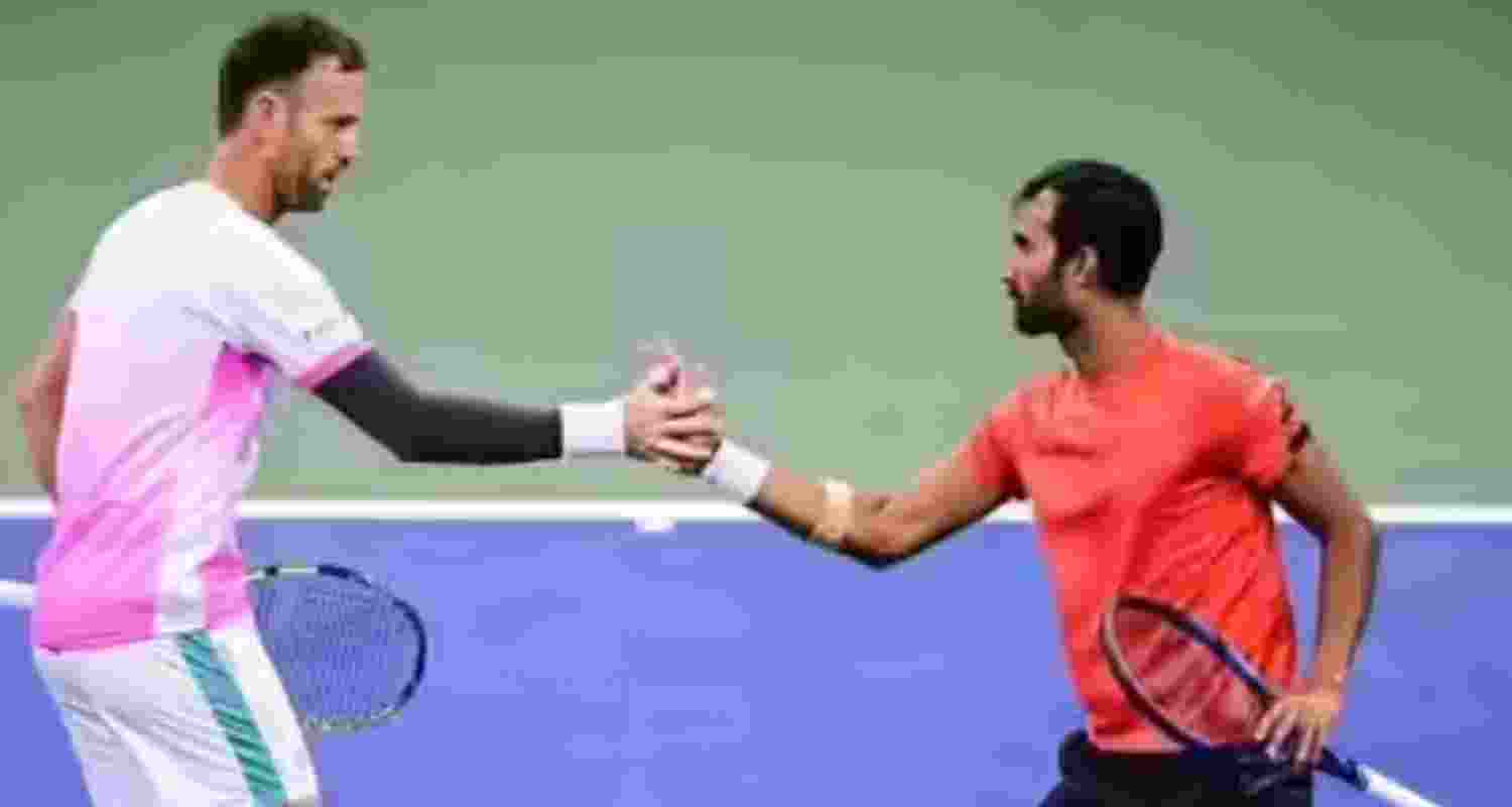  Yuki Bhambri shakes hands with Nikola Mektic (left) after the quarterfinal at US Open.