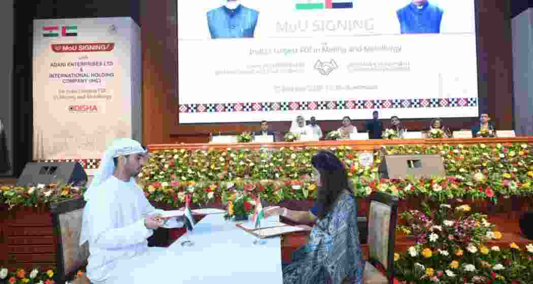 Adani Enterprises Limited and International Resources Holding representatives signing the MoU in the presence of Odisha Chief Minister Mohan Charan Majhi, Industries Minister Sampad Chandra Swain, IHC Group CEO Syed Basar Shueb and Karan Adani, MD of Adani Ports and Special Economic Zone, in Bhubaneswar on Thursday.