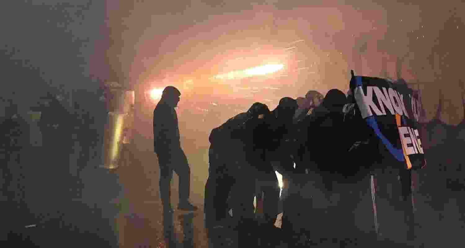 Protesters clashed with police in Milan after the Winter Olympics opening, as activists decried the Games as unsustainable; rail sabotage disrupted services.