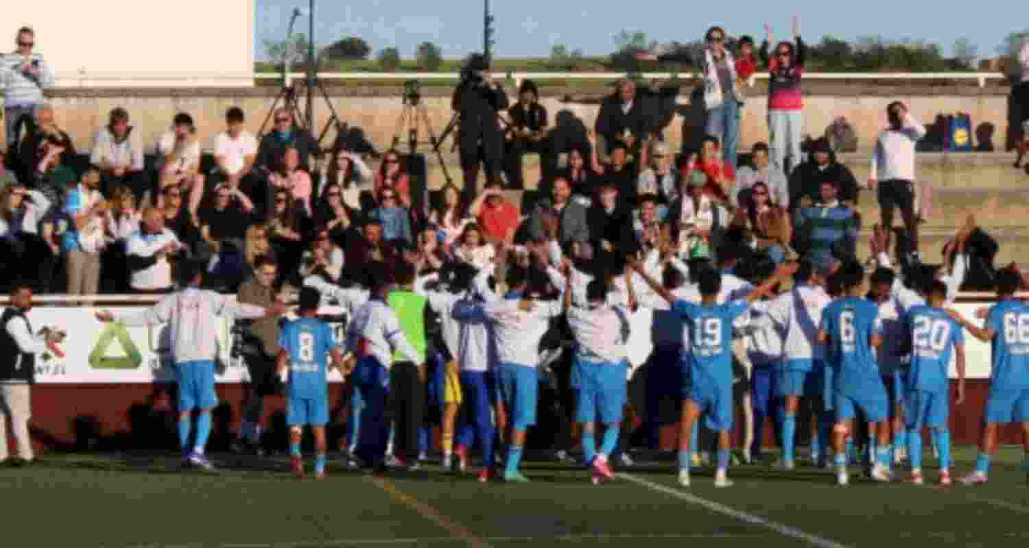 Minerva Academy players celebrating their historic win.