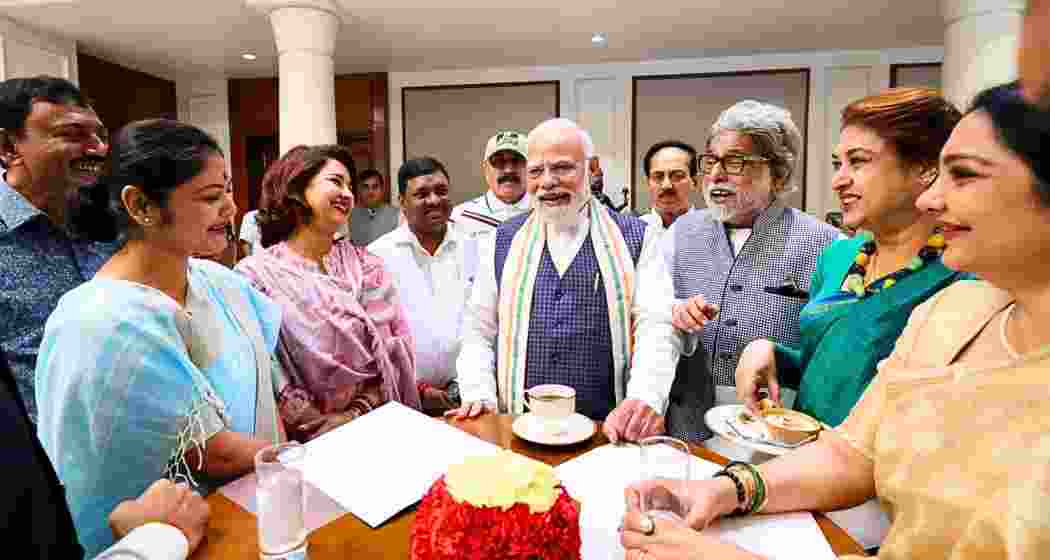 Prime Minister Narendra Modi interacts with rebel MPs from the Trinamool Congress and Shiv Sena (UBT) during an NDA breakfast meeting in New Delhi on Friday. | X/@narendramodi.
