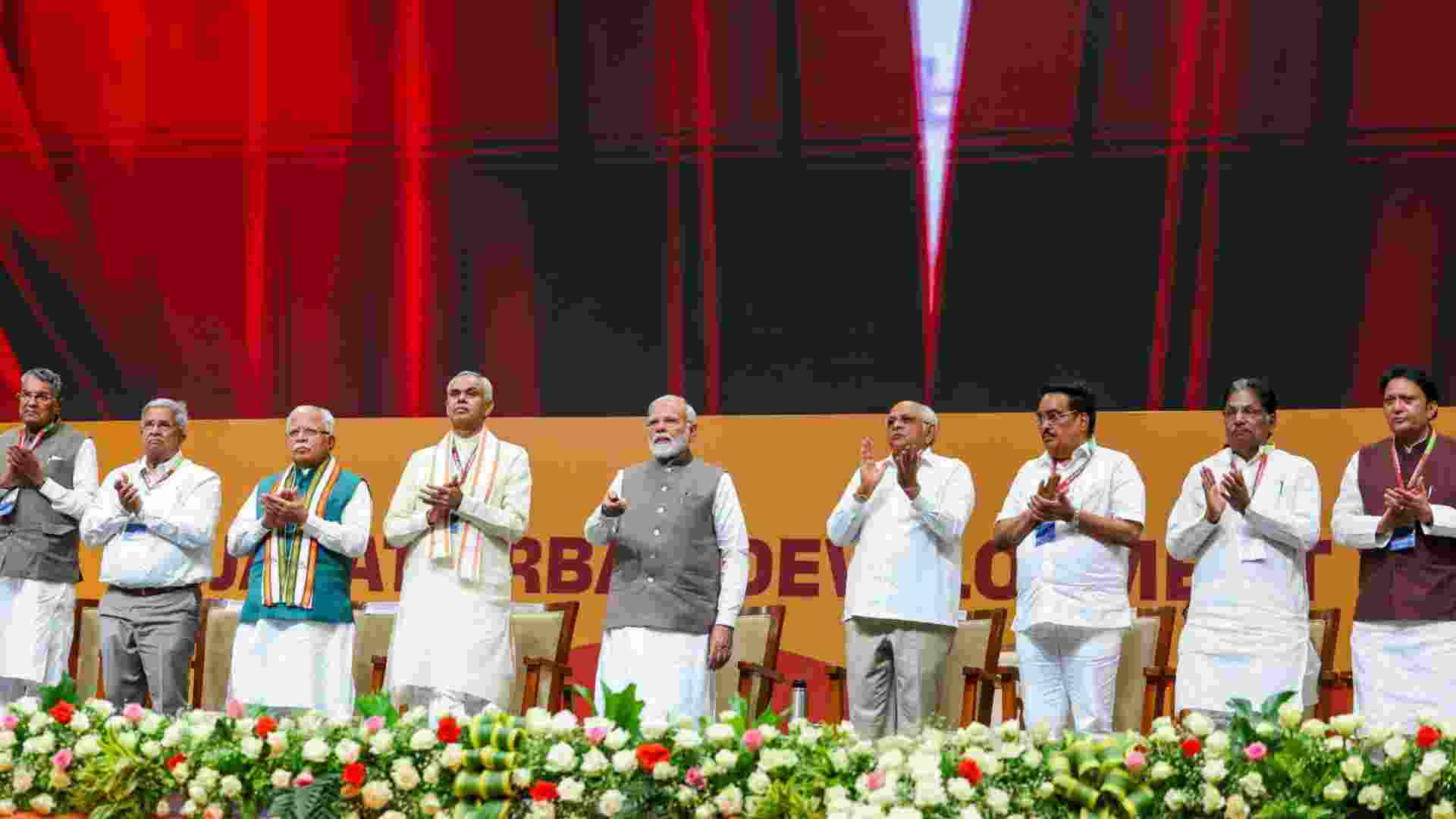 Prime Minister Narendra Modi launches the Urban Development Year, 2025 during celebration of 20 years of Gujarat's Urban Growth Story, in Gandhinagar, Tuesday. Governor Acharya Devvrat, Chief Minister Bhupendra Patel, Union Ministers Manohar Lal and C.R. Patil are also seen.