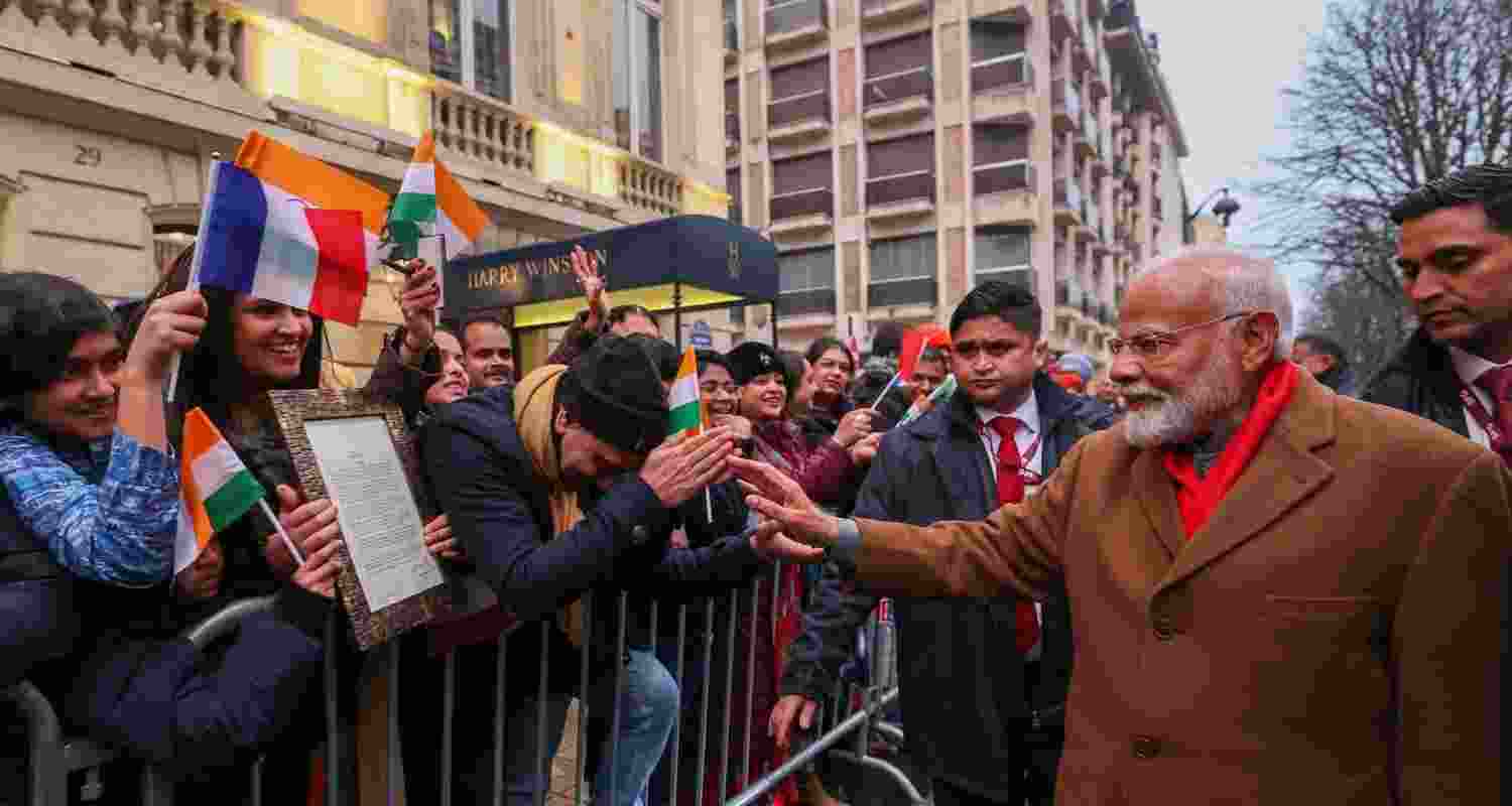 Prime Minister Narendra Modi is welcomed by the Indian diaspora in Paris, France, Monday.