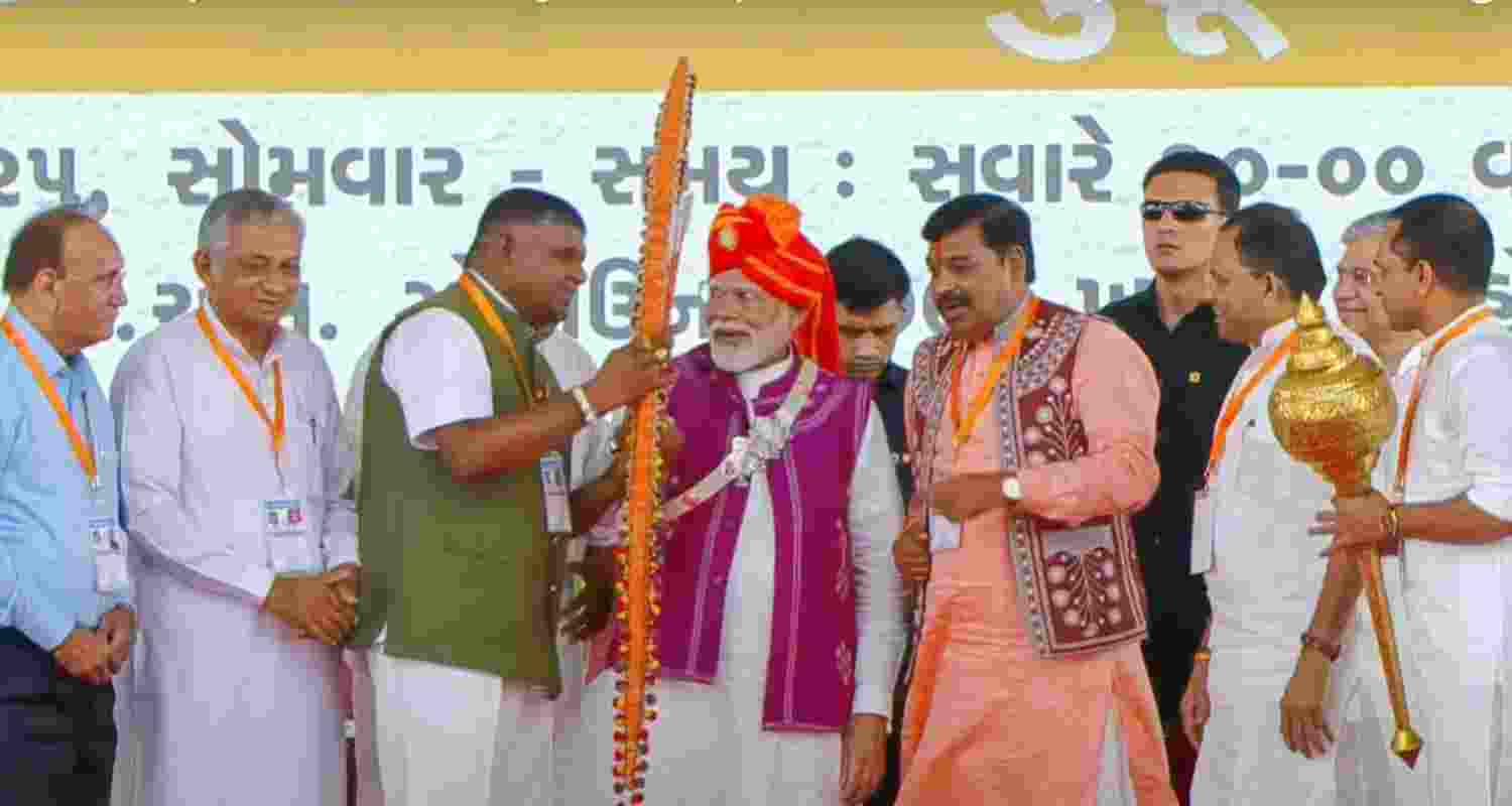 Prime Minister Narendra Modi being with others at a public meeting during the inauguration of Loco Manufacturing Shop and various development projects, in Dahod, Monday. Prime Minister Narendra Modi being with others at a public meeting during the inauguration of Loco Manufacturing Shop and various development projects, in Dahod, Monday.