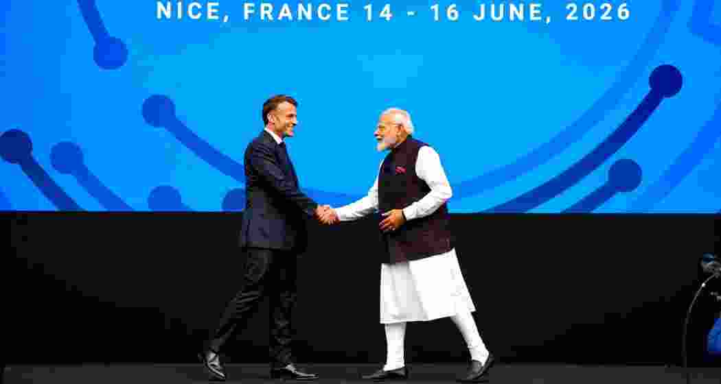 France's President Emmanuel Macron shakes hands with Prime Minister Narendra Modi on stage during the Bharat Innovate 2026 event in Nice, France. 