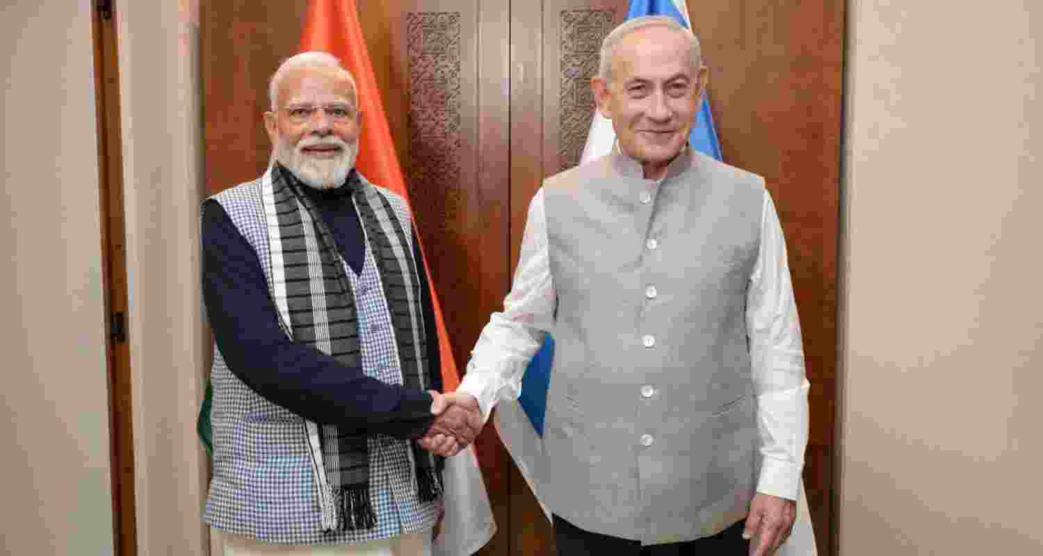 Israeli Prime Minister Benjamin Netanyahu, with PM Narendra Modi, in traditional Indian attire for their dinner meeting in Tel Aviv.