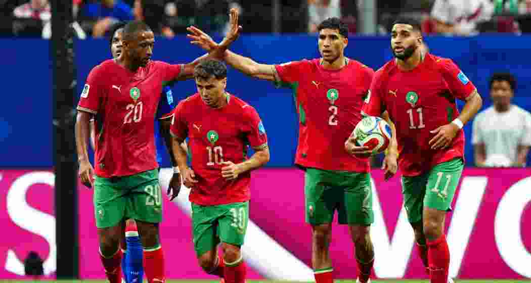 Morocco players celebrate after scoring a goal during a match against Haiti in Atlanta, sealing qualification for the Round of 32 and setting African World Cup records.
