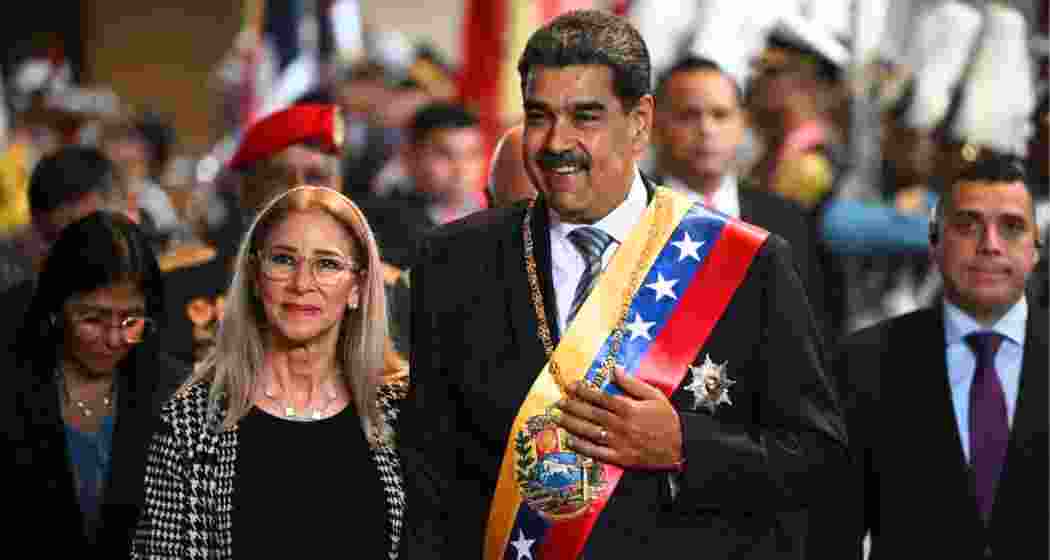 Venezuela's President Nicolas Maduro arrives with his wife Cilia Flores to deliver his annual speech to parliament in Caracas on January 15, 2025.