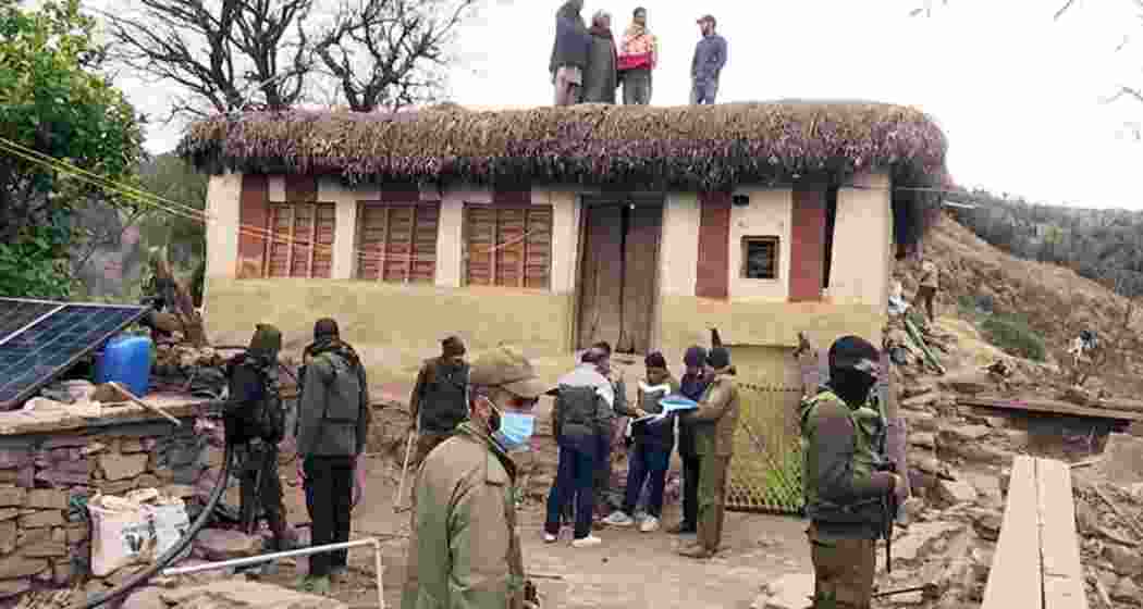 Officials and experts investigate a house in Rajouri district amid a mysterious illness outbreak, which has tragically claimed 17 lives.