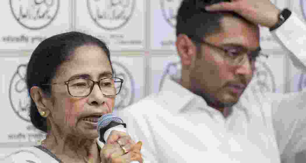Banerjee, flanked by Abhishek Banerjee, addresses a press conference, at her Kalighat residence in Kolkata. (Photo: PTI)