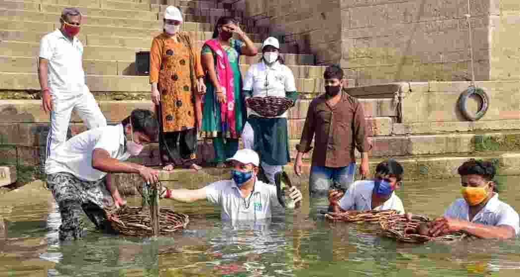 Volunteers engaged in cleaning operations along a the Ganga riverbank as part of ongoing efforts to reduce pollution and restore river ecology.