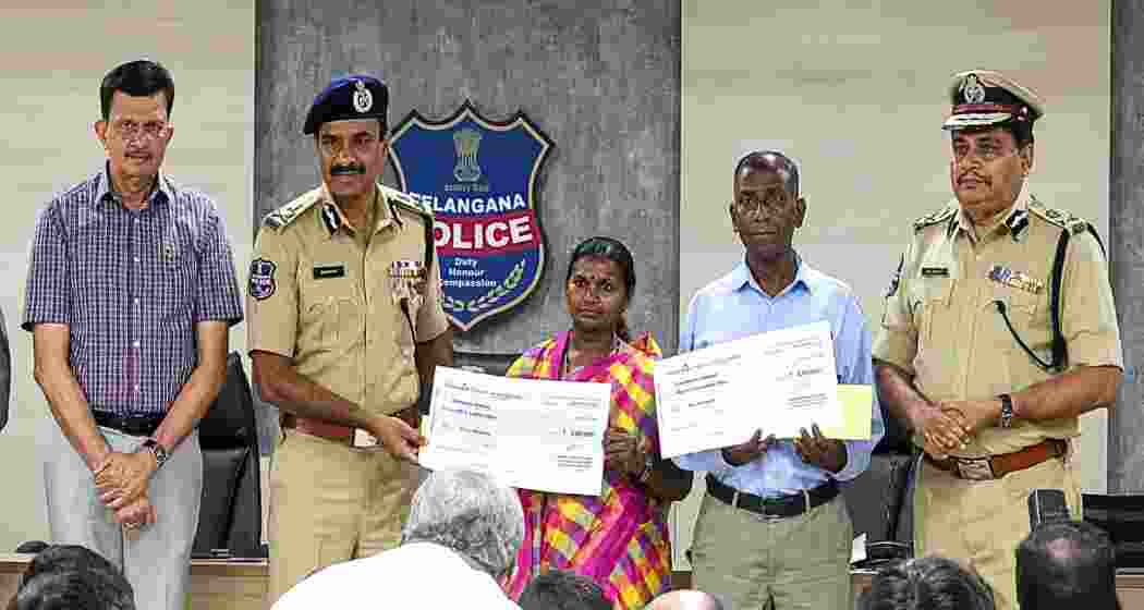 Senior Maoist leader Pasunuri Narahari and his wife Medara Danamma after surrendering before Telangana DGP C V Anand in Hyderabad on Wednesday.