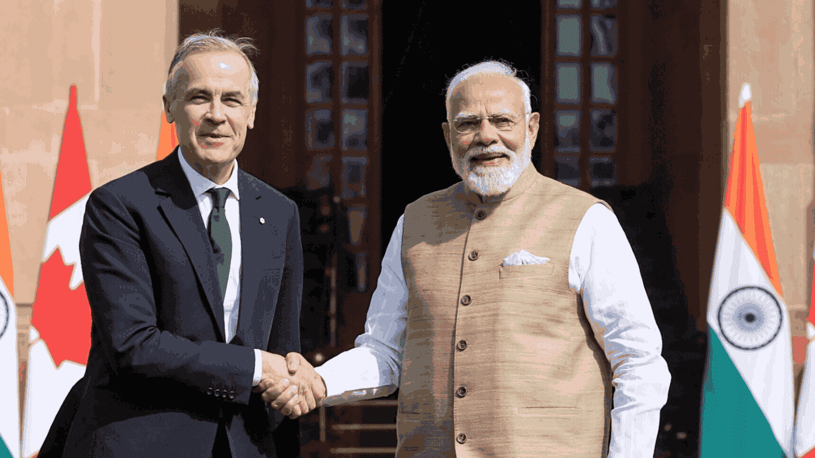 Prime Minister Narendra Modi shaking hands with Mark Carney