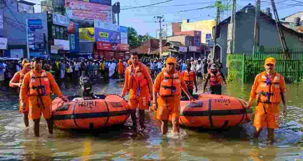NDRF personnel conduct rescue operations in flood-hit areas of Sri Lanka, assisting stranded families and ensuring their safety, as India delivers relief under Operation Sagar Bandhu.
