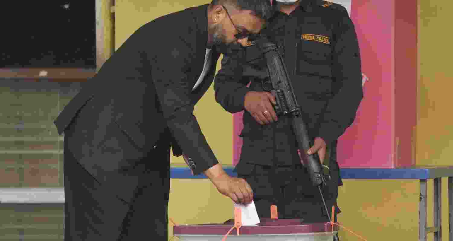 Rastriya Swatantra Party (RSP) prime ministerial candidate and former Kathmandu Mayor Balendra Shah casts a vote in the Nepal general elections, in Kathmandu. 
