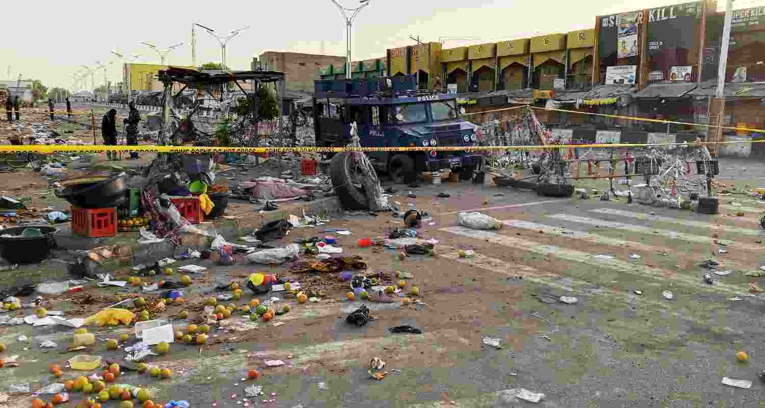Police officers are seen at the scene of a bomb blast at a market in Maiduguri, Nigeria, Tuesday, March 17, 2026.