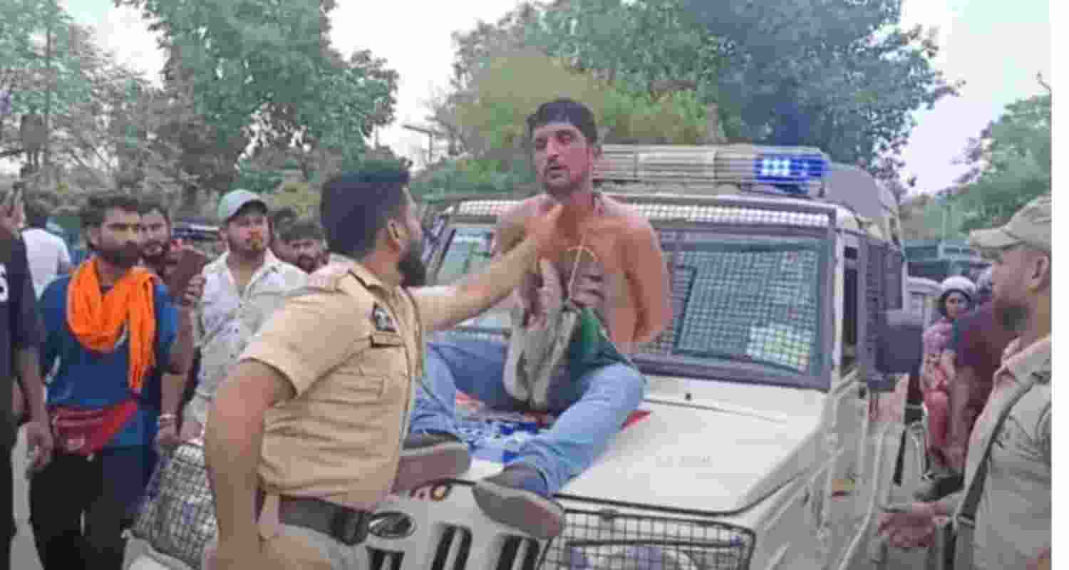 Enquiry ordered into parading of 'thief' on police vehicle