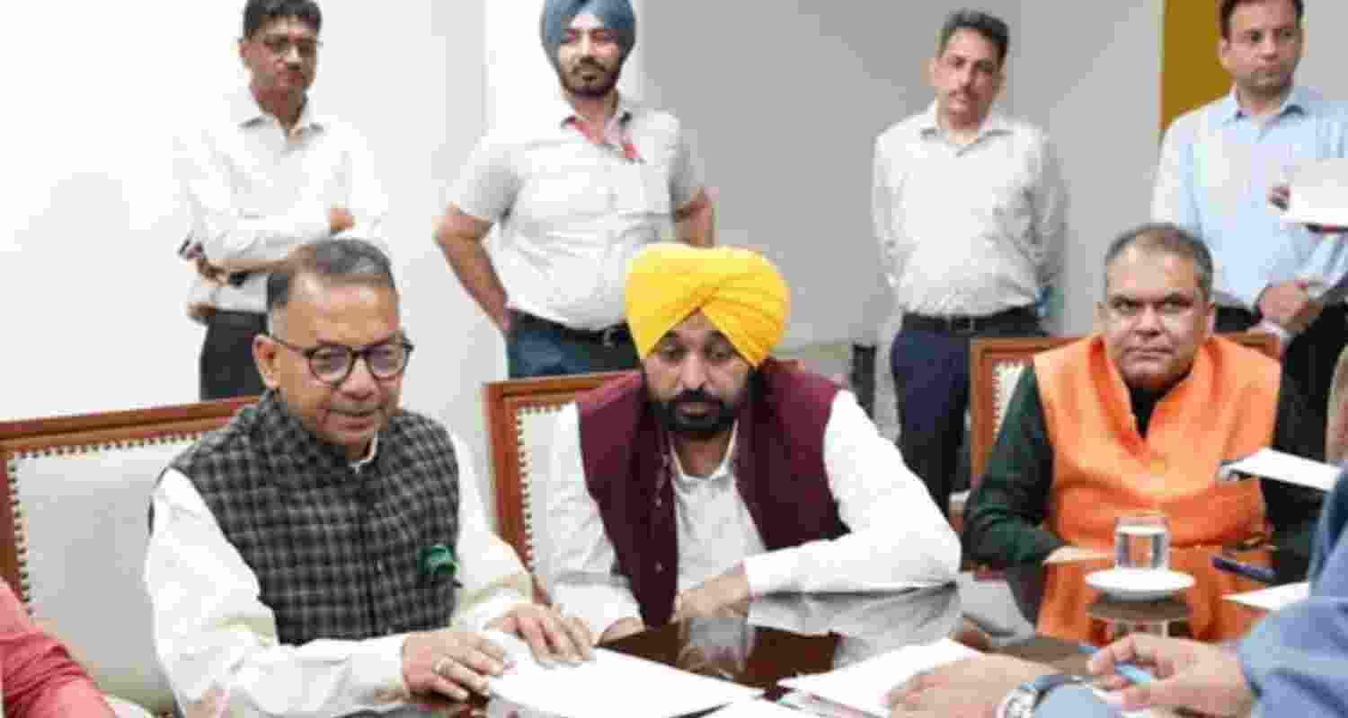 Industrialist Rajinder Gupta filing his nomination papers in the Punjab Vidhan Sabha on Friday as Chief Minister Bhagwant Mann and Cabinet Minister Sanjeev Arora look on.