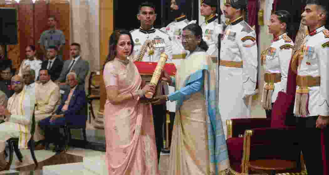 President Droupadi Murmu confers the Padma Vibhushan to veteran actor Dharmendra posthumously, received by BJP MP Hema Malini on his behalf, during a Civil Investiture Ceremony, at Rashtrapati Bhavan in New Delhi, on Monday. (PTI Photo/Shahbaz Khan)