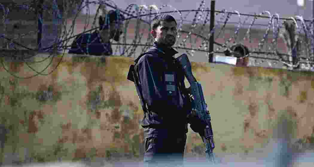 A security personnel stands guard near the site of a funeral ceremony for victims of a suicide blast, a day after the attack at a mosque in Islamabad, Pakistan on February 7, 2026.