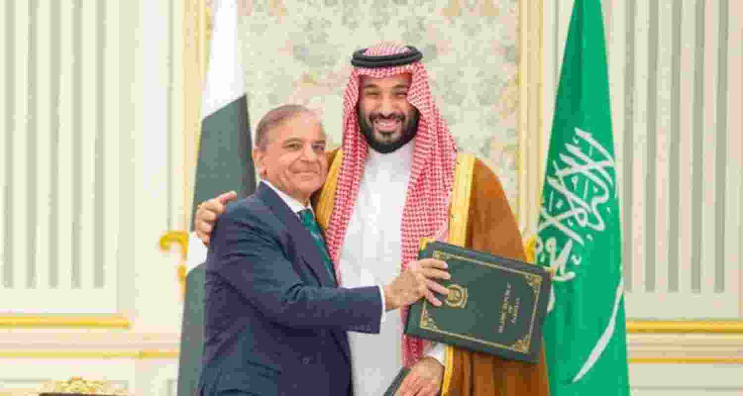 Pakistan PM Shehbaz Sharif and Saudi Crown Prince Mohammed bin Salman embrace after signing the agreement on September 17.