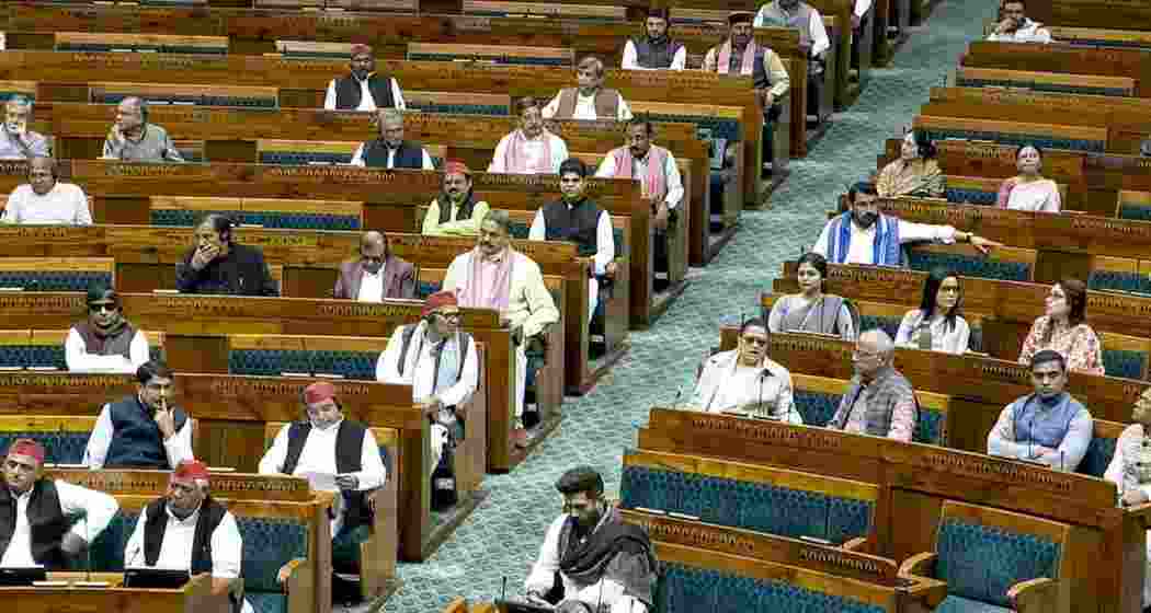 From left, in front row, Samajwadi Party President Akhilesh Yadav with his party leaders and Union Minister and Lok Janshakti Party (Ram Vilas) chief Chirag Paswan and other members in the well on the first day of the Winter Session of Parliament, in New Delhi.