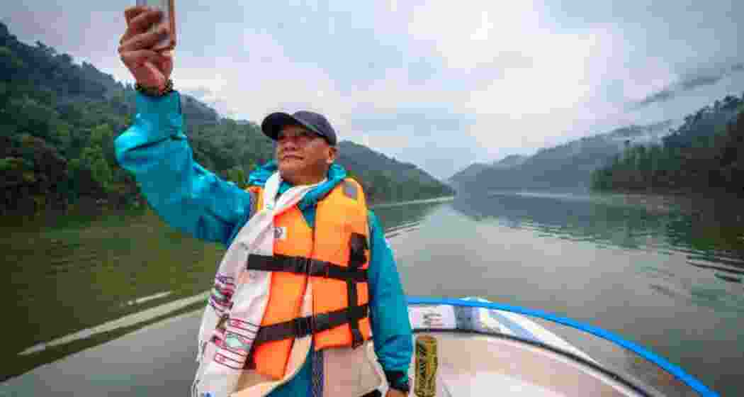 Arunachal Pradesh Chief Minister Pema Khandu clicks photographs during his visit to the Subansiri Lower Hydroelectric Project site, reviewing plans to develop the reservoir area into a tourism hub.