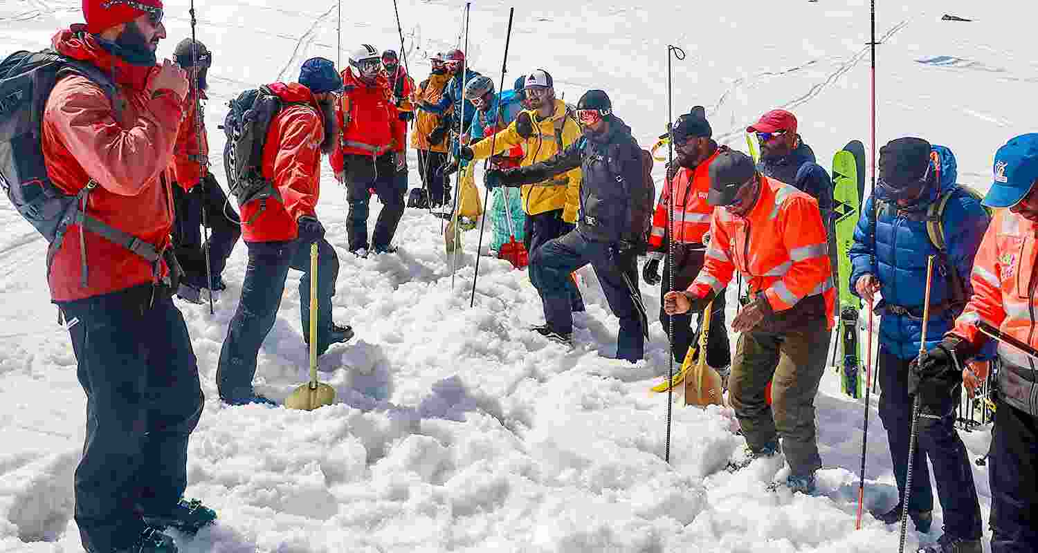Personnel of Indian Army ski patrol team, J&K Police rescue team, local ski guides and the tourism department take part in a snow avalanche rescue exercise drill