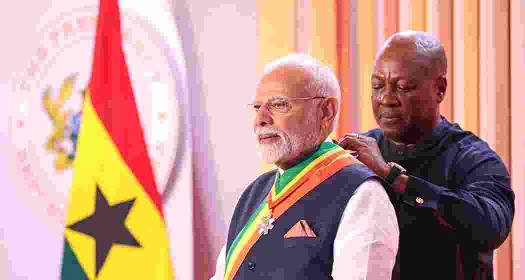 Prime Minister Narendra Modi receives Ghana’s highest civilian honour from President John Mahama at Jubilee House in Accra on Thursday, during the first Indian prime ministerial visit in 30 years. Prime Minister Narendra Modi receives Ghana’s highest civilian honour from President John Mahama at Jubilee House in Accra on Thursday, during the first Indian prime ministerial visit in 30 years.