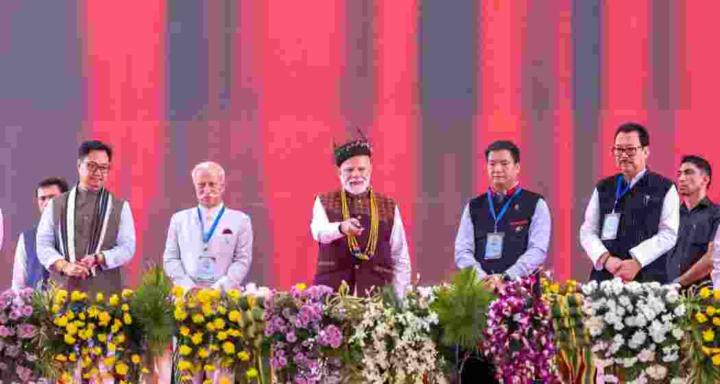 Prime Minister Narendra Modi with Kiren Rijiju, Pema Khandu, Arunachal Governor and officials during the inauguration ceremony in Itanagar on Monday.