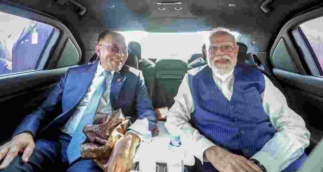 Prime Minister Narendra Modi shares car ride with his Malaysian counterpart Anwar Ibrahim upon arrival in Kuala Lumpur, Malaysia on Saturday.