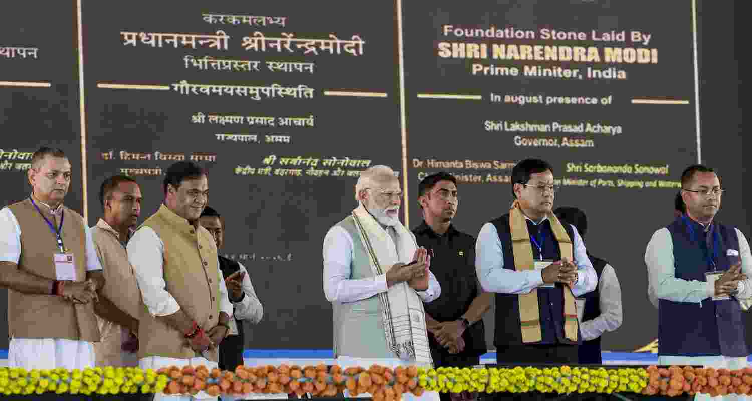 Prime Minister Narendra Modi, centre, Union Minister of Ports, Shipping and Waterways Sarbananda Sonowal, second right, Assam Chief Minister Himanta Biswa Sarma, third left, and others, during the foundation stone laying and unveiling ceremony of various development works, in Silchar, Assam.