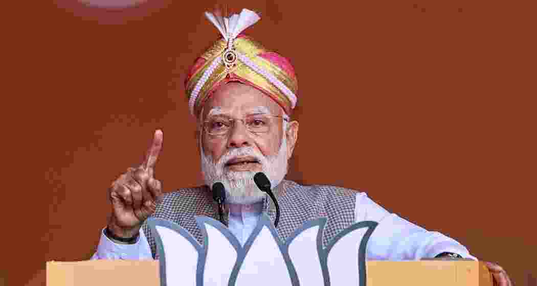 Prime Minister Narendra Modi addresses the gathering during a public meeting, at the Hindustan Aeronautics Limited Airport, in Bengaluru, Karnataka on Sunday.