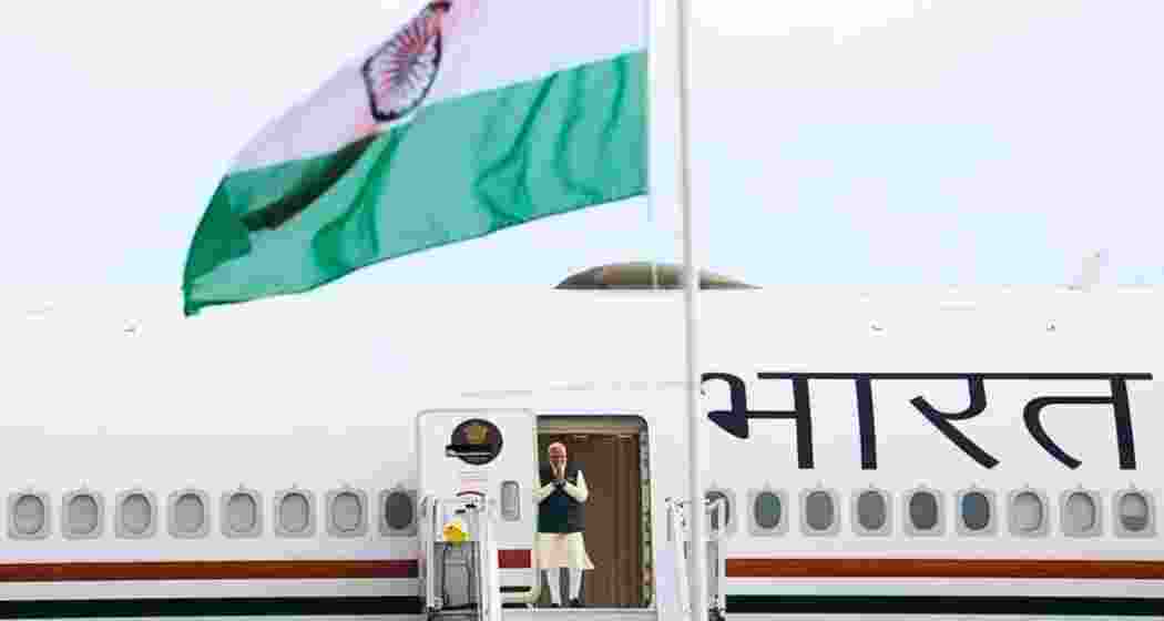 Prime Minister Narendra Modi deboards from his aircraft during his five-nation Europe and Gulf tour covering the UAE, the Netherlands, Sweden, Norway and Italy.