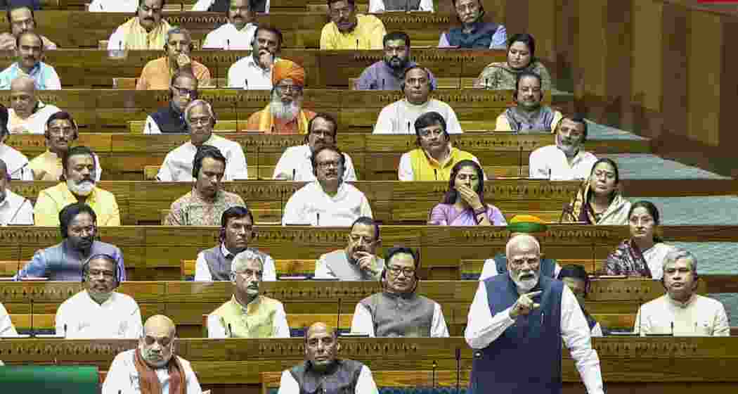 Prime Minister Narendra Modi speaks in the Lok Sabha during the Special session of Parliament, in New Delhi, on Thursday.