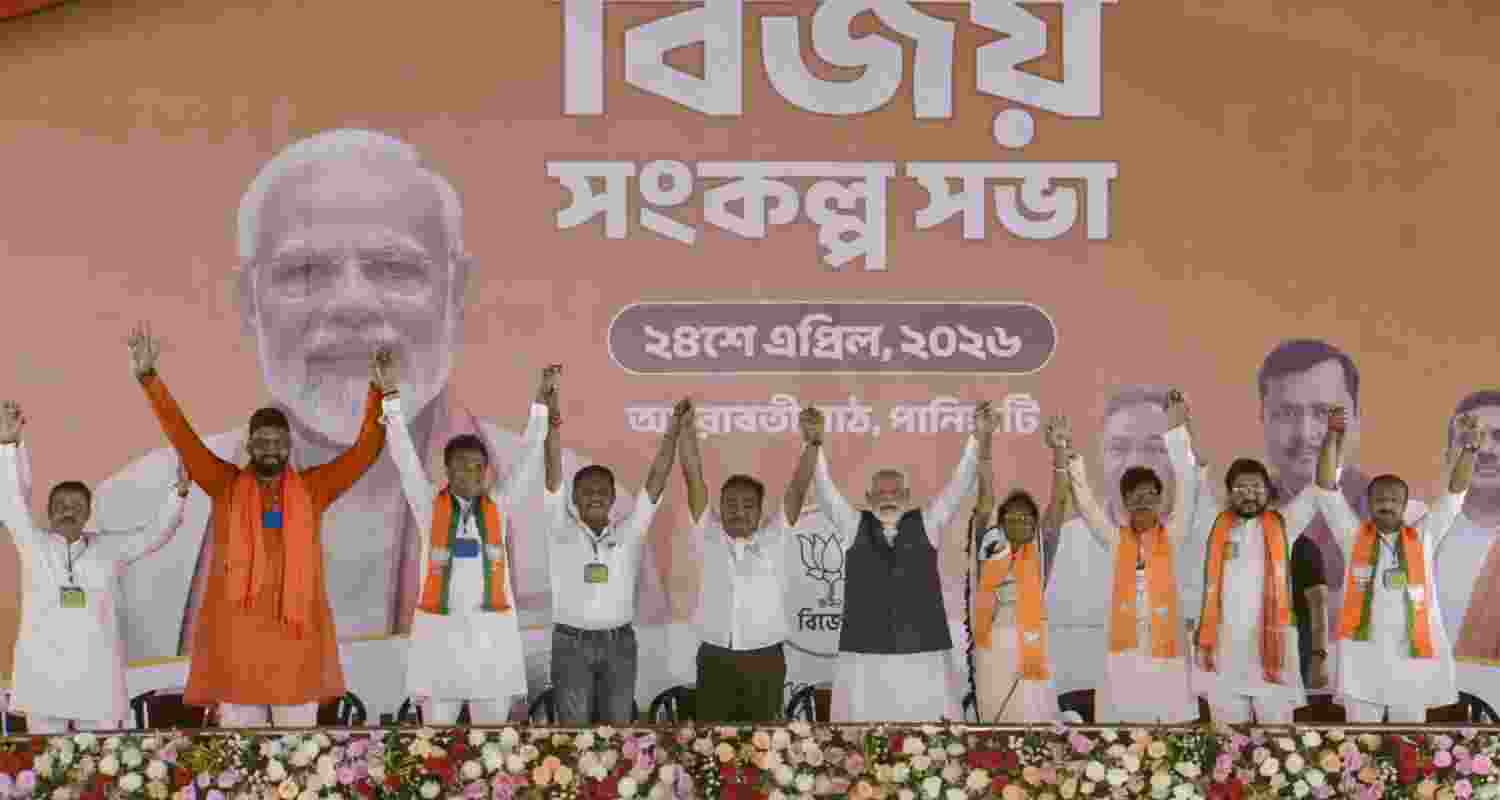 In this image posted on April 24, 2026, Prime Minister Narendra Modi with party candidates during a campaign for the West Bengal Assembly elections, in Dum Dum, North 24 Parganas district. 