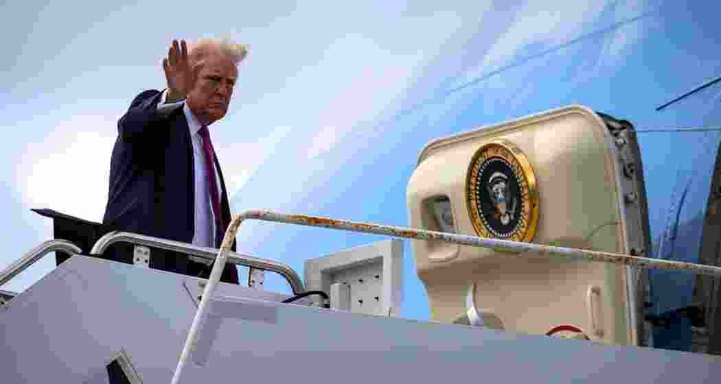 US President Donald Trump waves as he boards Air Force One, on Sunday, at Palm Beach International Airport in West Palm Beach, Fla. (Photo: AP)