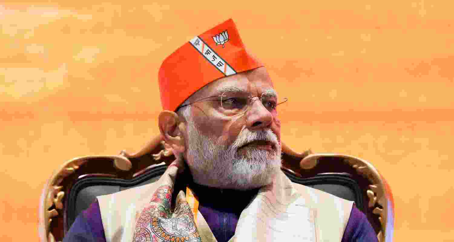 PM modi wearing a BJP cap during the party's national council meeting,