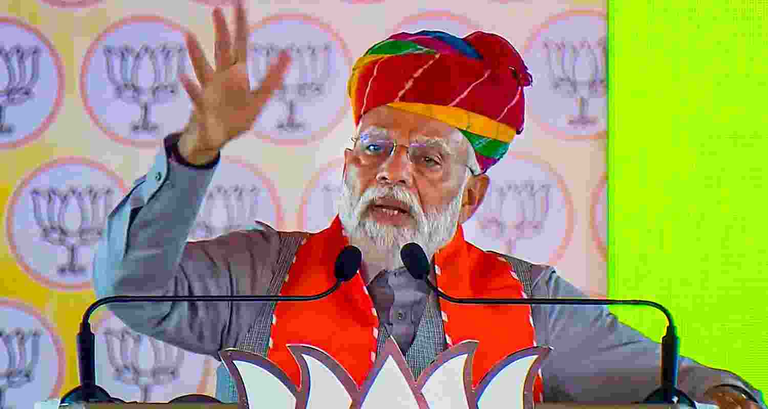 Prime Minister Narendra Modi being felicitated during a public meeting in Karauli. 