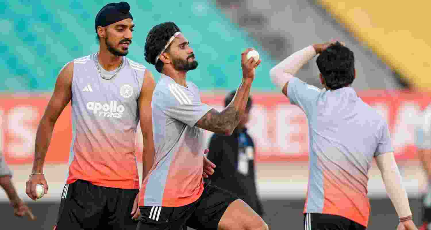 Pacers Arshdeep Singh (left) and Nitish Reddy (centre) during a training session ahead of the second ODI match between India and New Zealand, at Niranjan Shah Stadium in Rajkot on Tuesday.