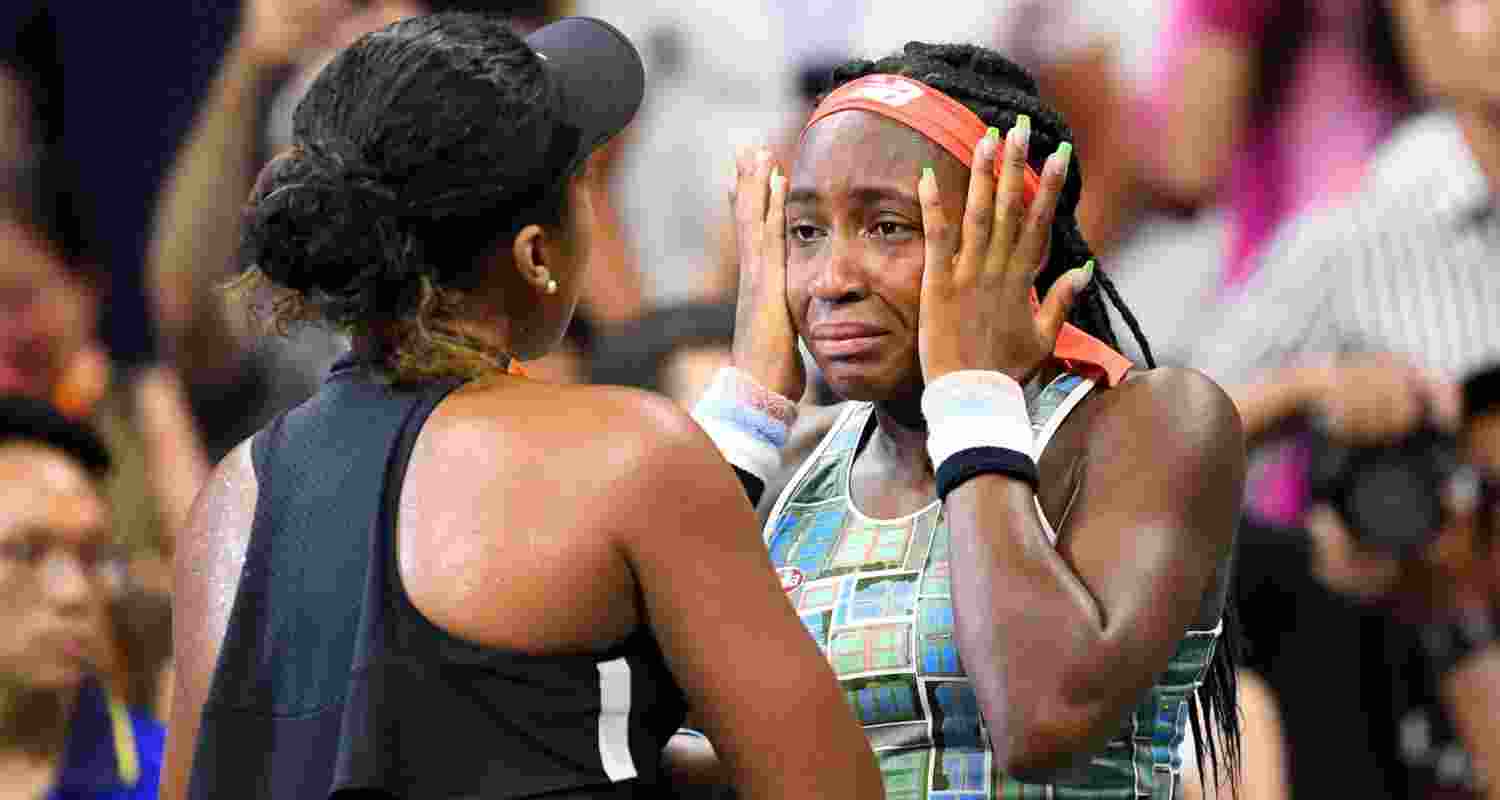 Naomi Osaka of Japan consoles Coco Gauff of the US after their third round match.