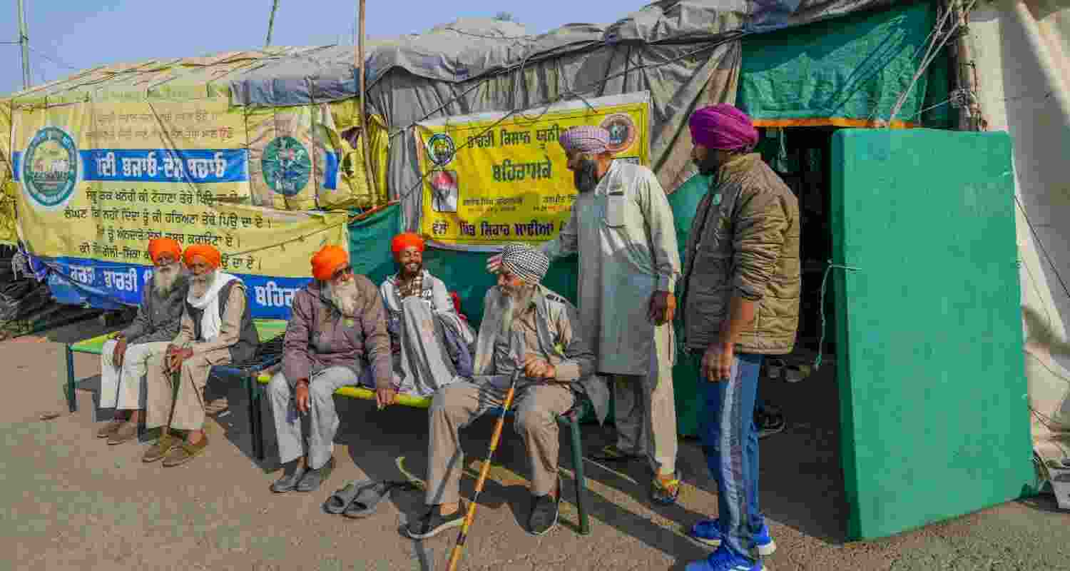 Patiala: Farmers take rest near their tractor-trolley tents a day after their Dilli Chalo march was suspended at Shambu border, in Patiala, Punjab, Monday,