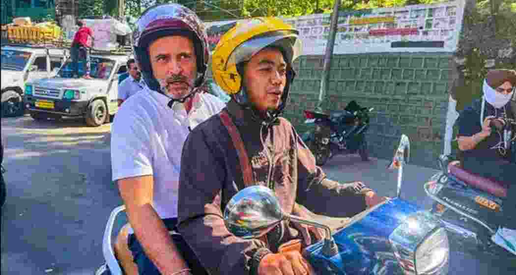 Rahul Gandhi riding pillion on a scooter in Aizawl, Mizoram.