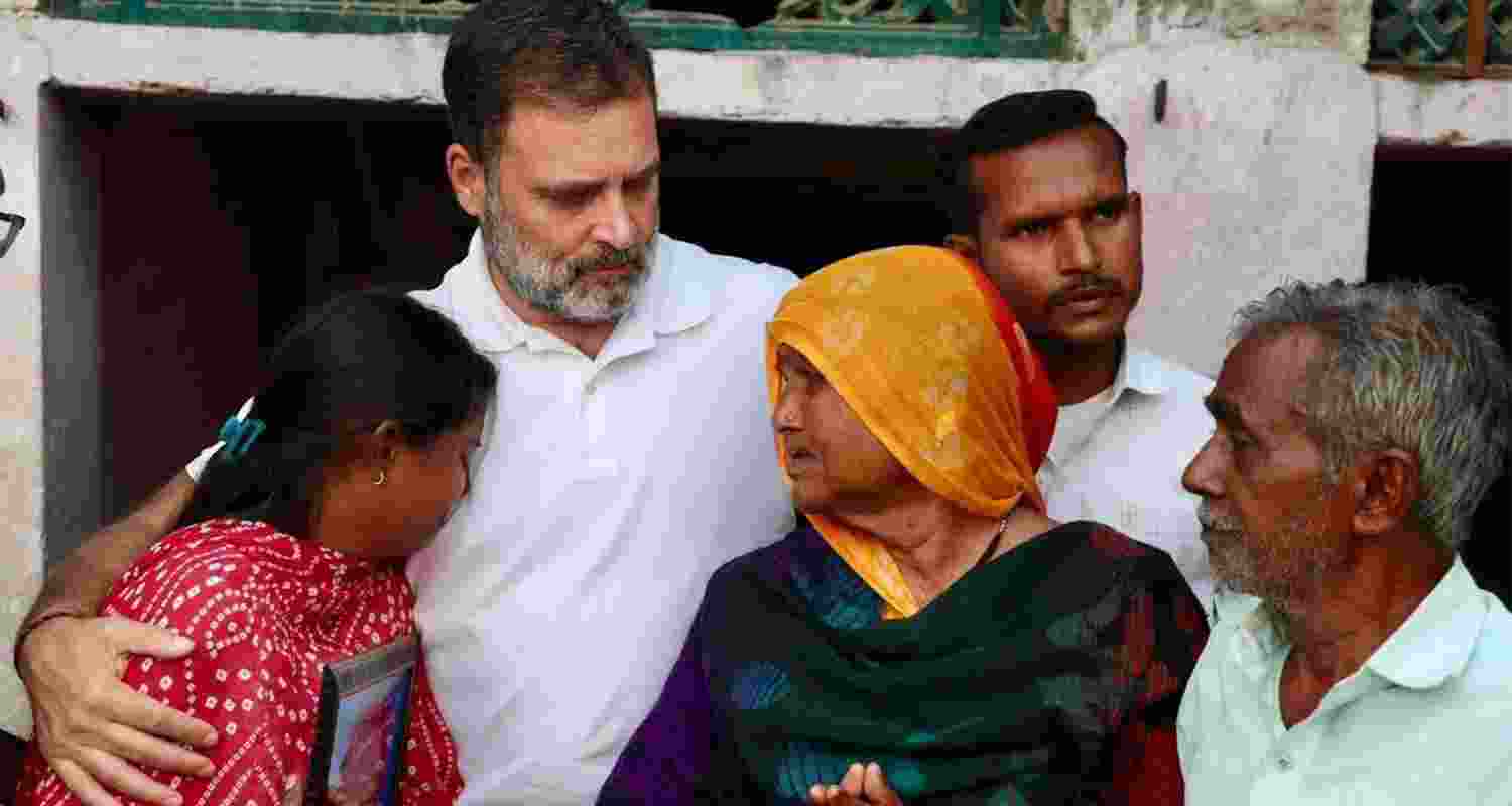 Rahul Gandhi with the family of the Dalit man.