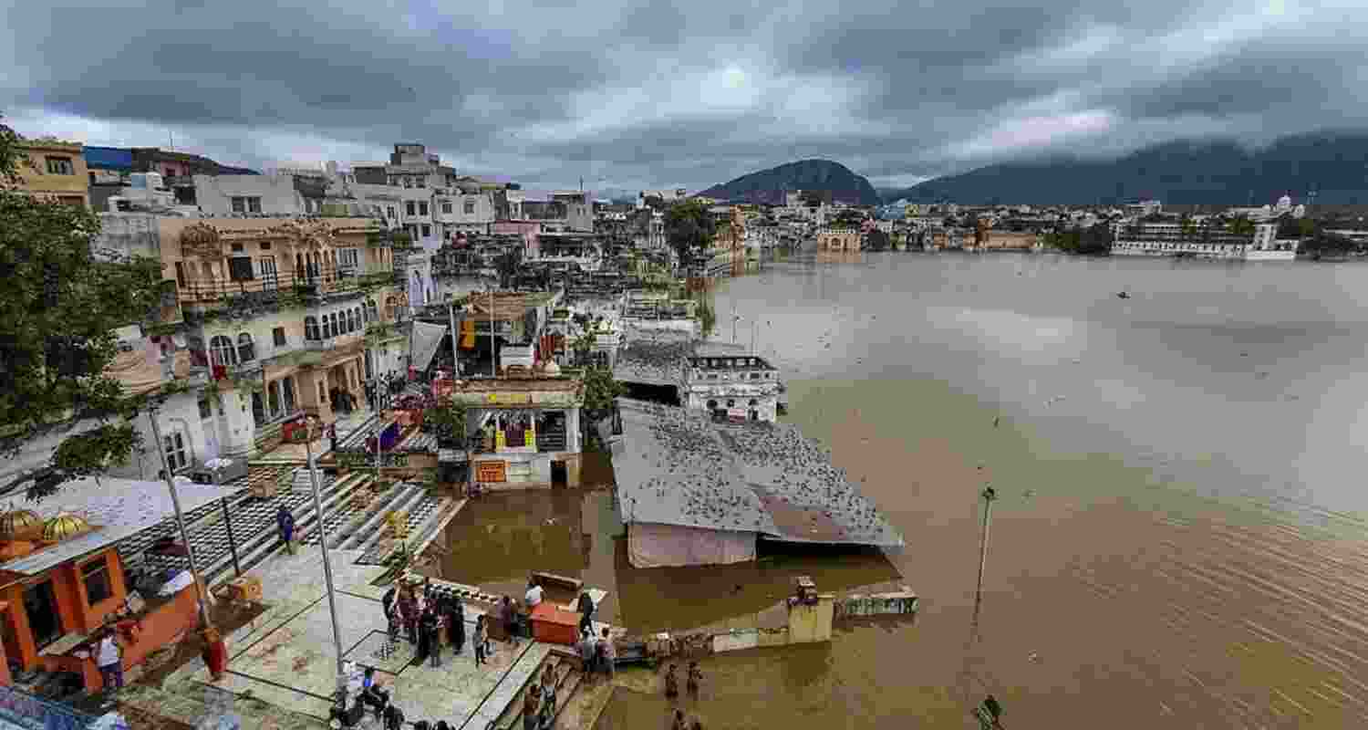 Submerged ghats in the swollen Pushkar Lake on a cloudy morning, in Pushkar.