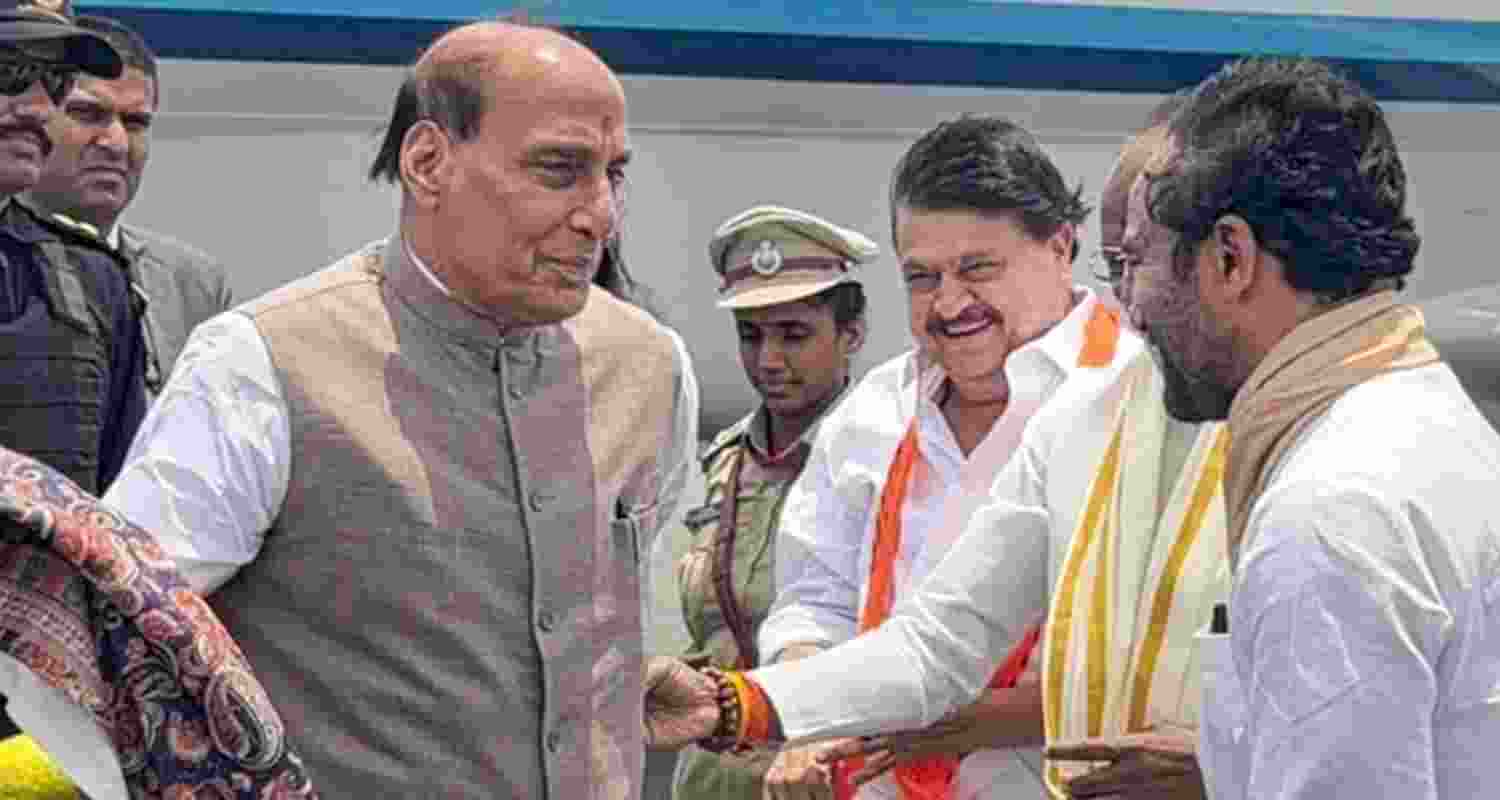 Union Defence Rajnath Singh being received by Union Minister G Kishan Reddy, Telangana BJP President N Ramchander Rao and others upon his arrival at the airport, in Hyderabad.
